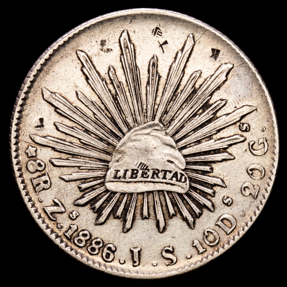 República de México. 8 Reales. (26,89 g.). Zacatecas. 1886. Ensayador J·S. KM-379.13. VF+. Resellos orientales