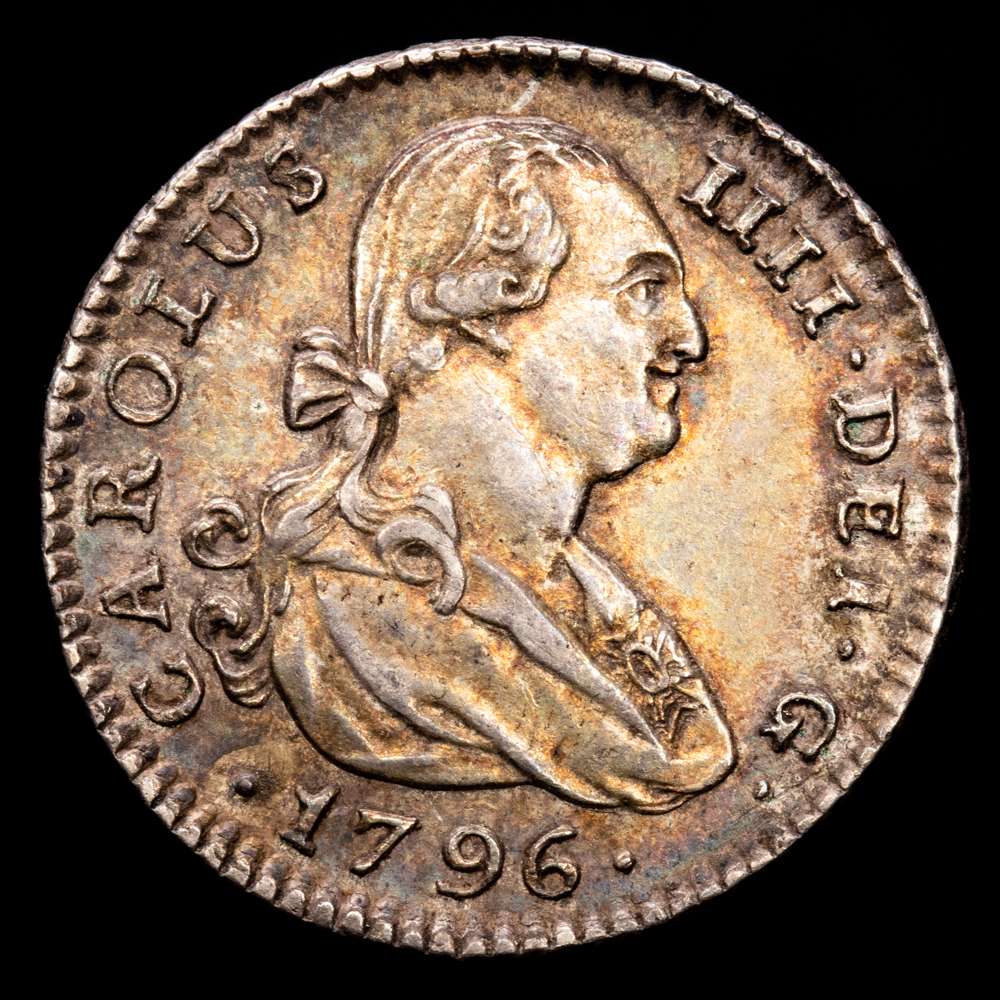 Carlos IV. 1 Real. (2,99 g.). Sevilla. 1796. C·N. AC-538. EBC+. Bellísimo tono oscuro iridiscente. Soberbio ejemplar. Muy rara en esta más que notable conservación