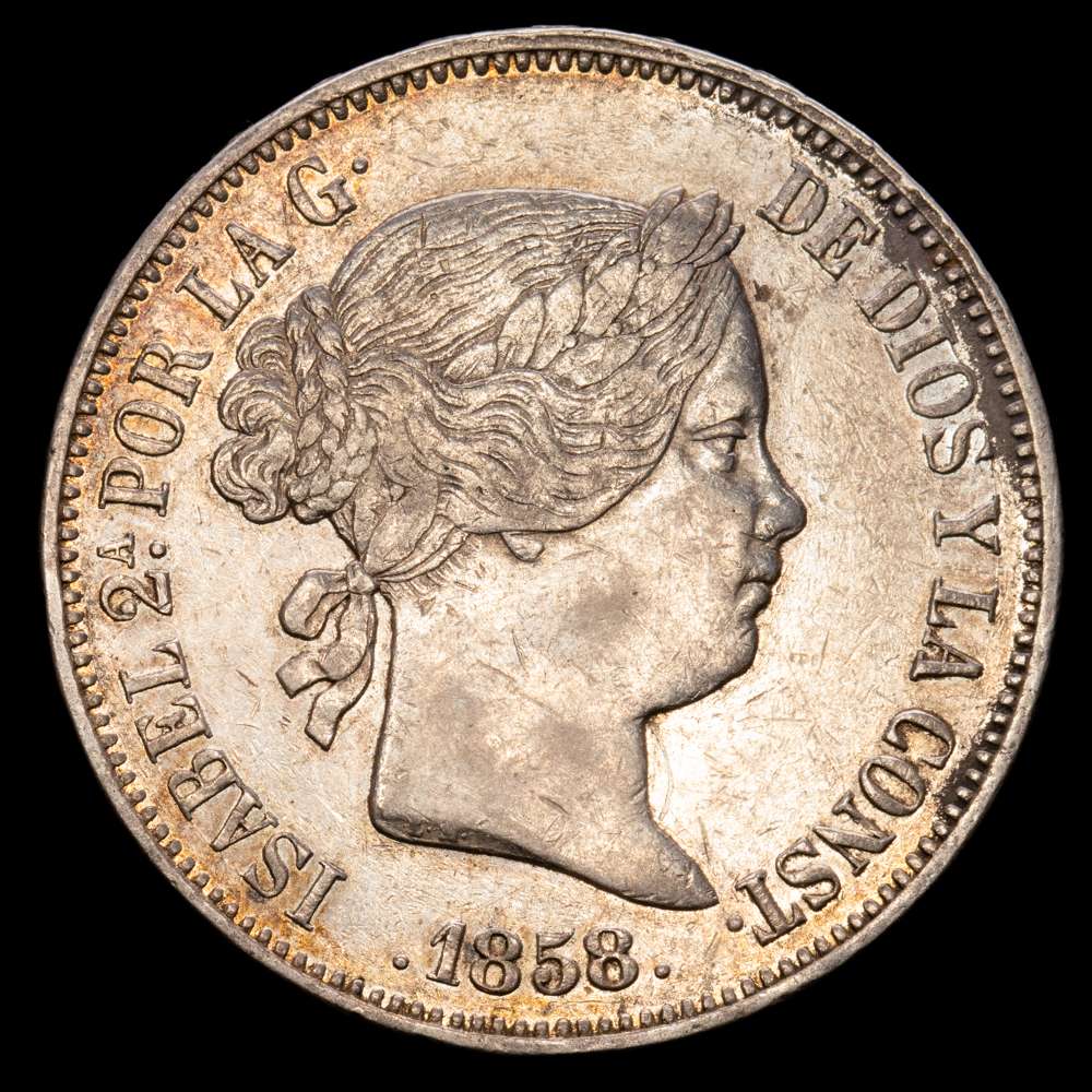 Isabel II (1833-1868). 20 reales. 1858. Madrid. (Cal-615). Ag. 25,81 g. Golpecitos en el canto y en anverso. Tono. Escasa así. EBC-.