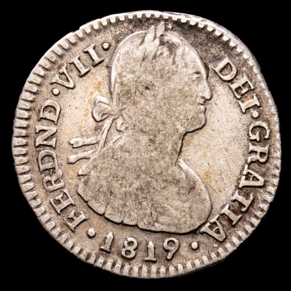 1819. Fernando VII. Santa Fe de Nuevo Reino. FJ (J invertida). 1 real. (AC. 658) (Restrepo 111-18). Busto de Carlos IV. Rara. 2,98 g. MBC-.