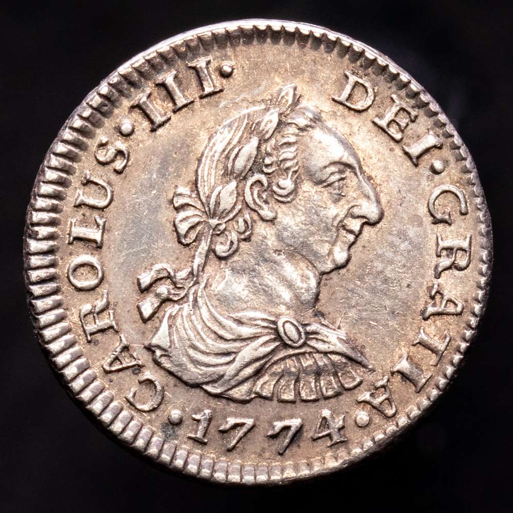Carlos III (1759-1788). 1/2 real. 1774. México. FM. (Cal-197). Ag. 1,69 gramos. Tono. Muy rara así. UNC-. R.B.O.