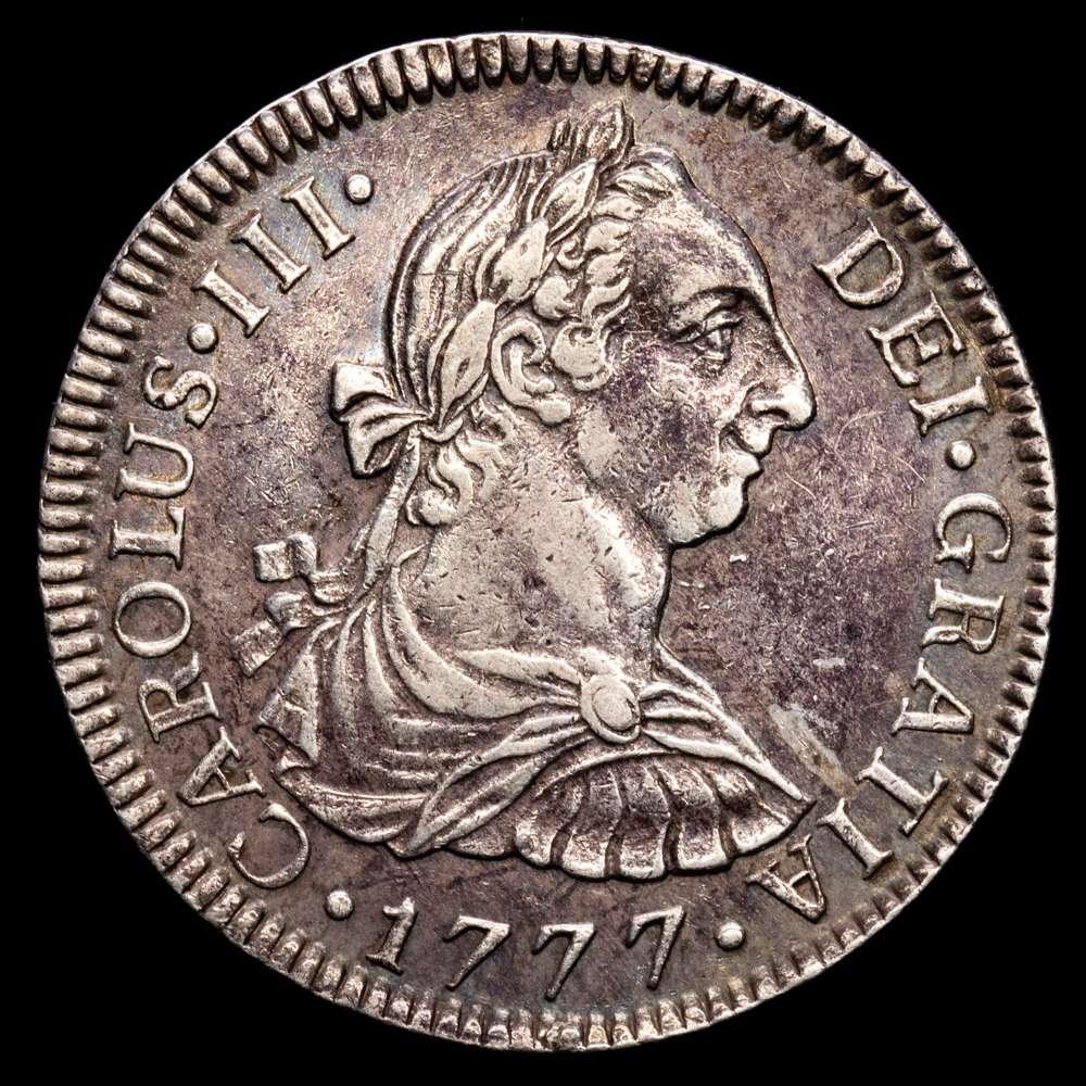 Carlos III (1759-1788). 2 reales. 1777. México. FM. (Cal-663). Ag. 6,75 gramos. Ligero tono iridiscente en el reverrso. MBC+.