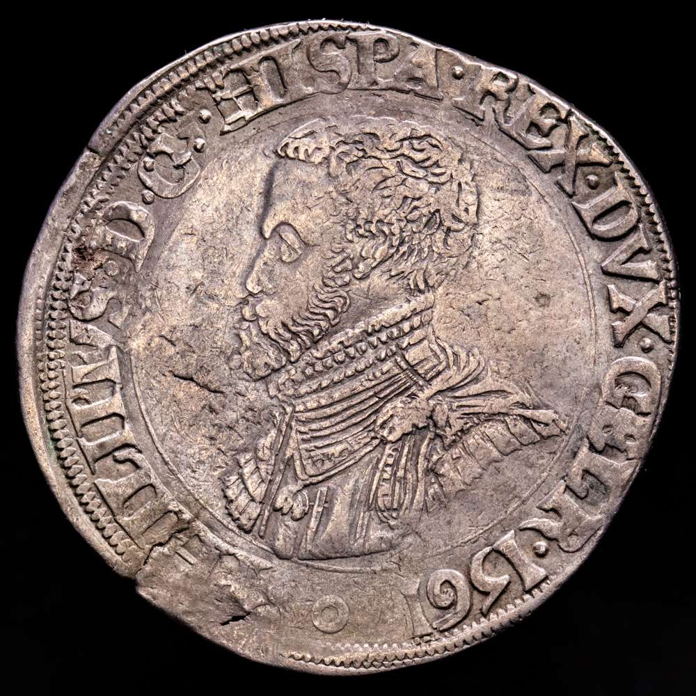 Felipe II (1556-1598). 1 escudo felipe. 1561. Niméga. (Tauler-1180). (Vti-1192). (Vanhoudt-265.NJ). Ag. 33,78 gramos. Ligera pátina. Escasa. MBC+.