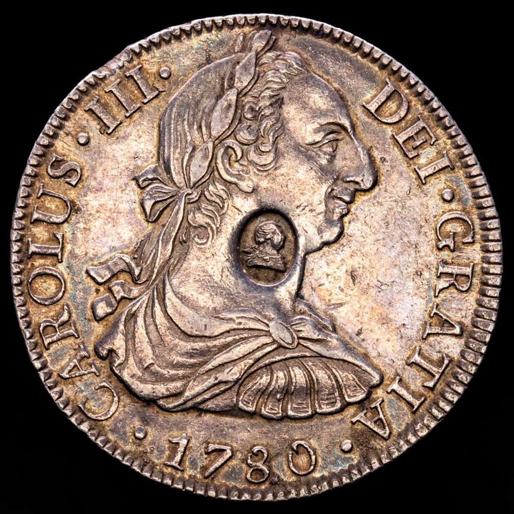 Carlos III (1759-1788). 8 reales. 1780. México. FM. (Cal-1120). Ag. 26,99 gramos. Resello ovalado con el busto de George III. (EBC). Rara. Bella pátina. EBC.