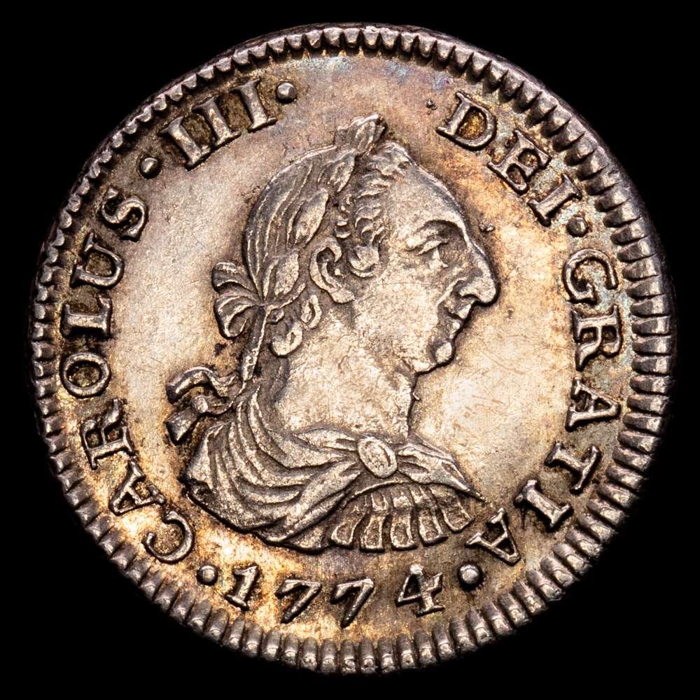 Carlos III (1759-1788). 1/2 real. 1774. México. FM. (Cal-197). Ag. 1,68 gramos. EBC. Tono. Conserva parte del brillo original.