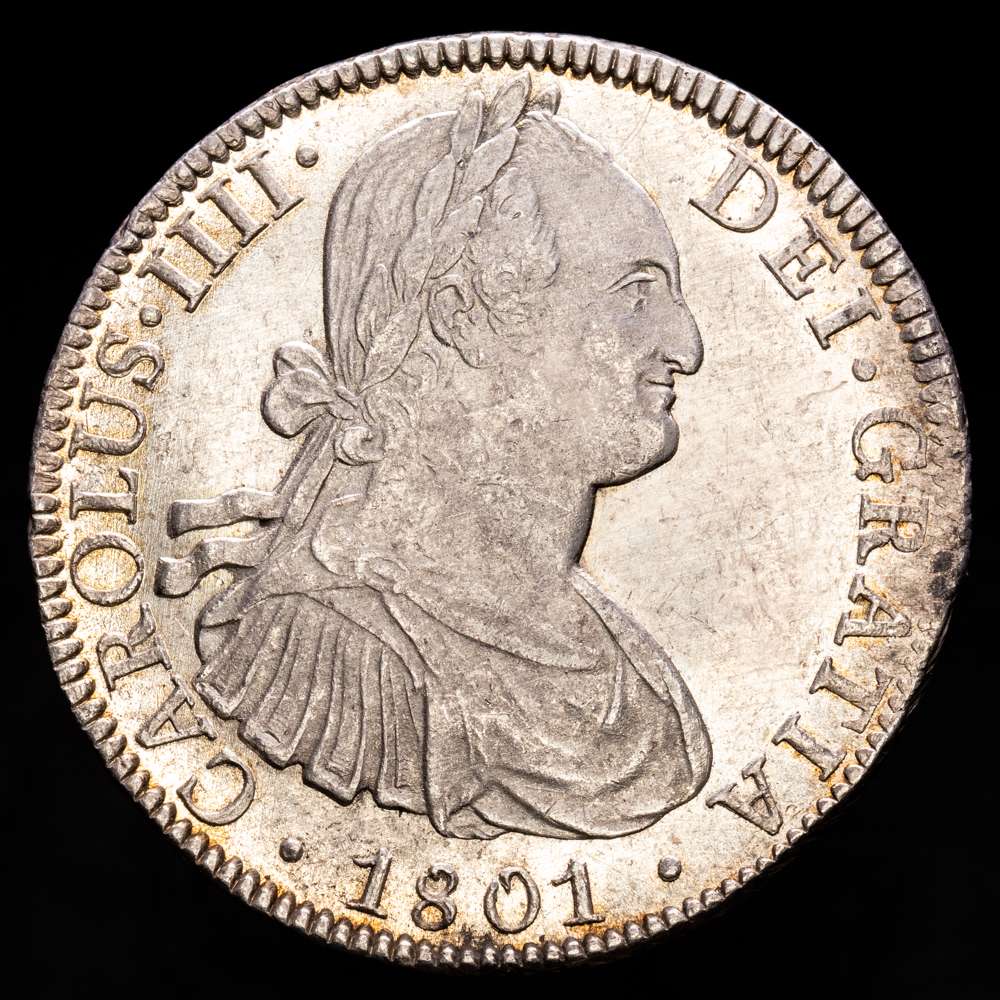 Carlos IV (1788-1808). 8 reales. 1801. México. FT. (Cal-972). Ag. 27,07 gramos. Gran parte del brillo original. Ínfimas rayitas en anverso. Bella. Escasa así. EBC+/SC-.