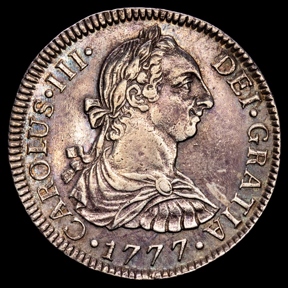 Carlos III (1759-1788). 2 reales. 1777. México. FM. (Cal-663). Ag. 6,75 gramos. Ligero tono iridiscente en el reverrso. MBC+.