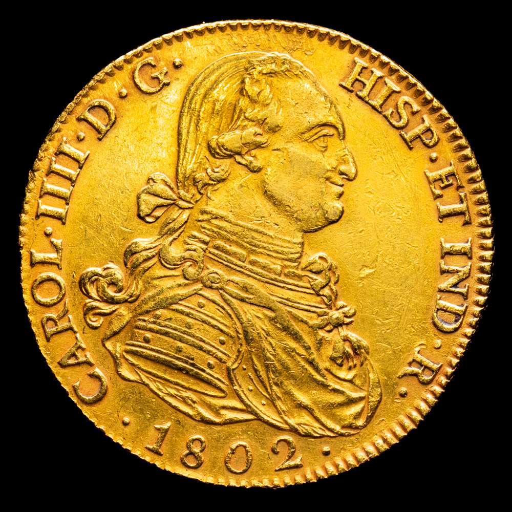Carlos IV (1788-1808). 8 escudos. 1802. Madrid. FA. (Cal-1621). (Cal onza-1012). Au. 26,78 gramos. Sin punto después de FELIX ni antes de AUSPICE. Hojas en reverso. EBC-/MBC+.