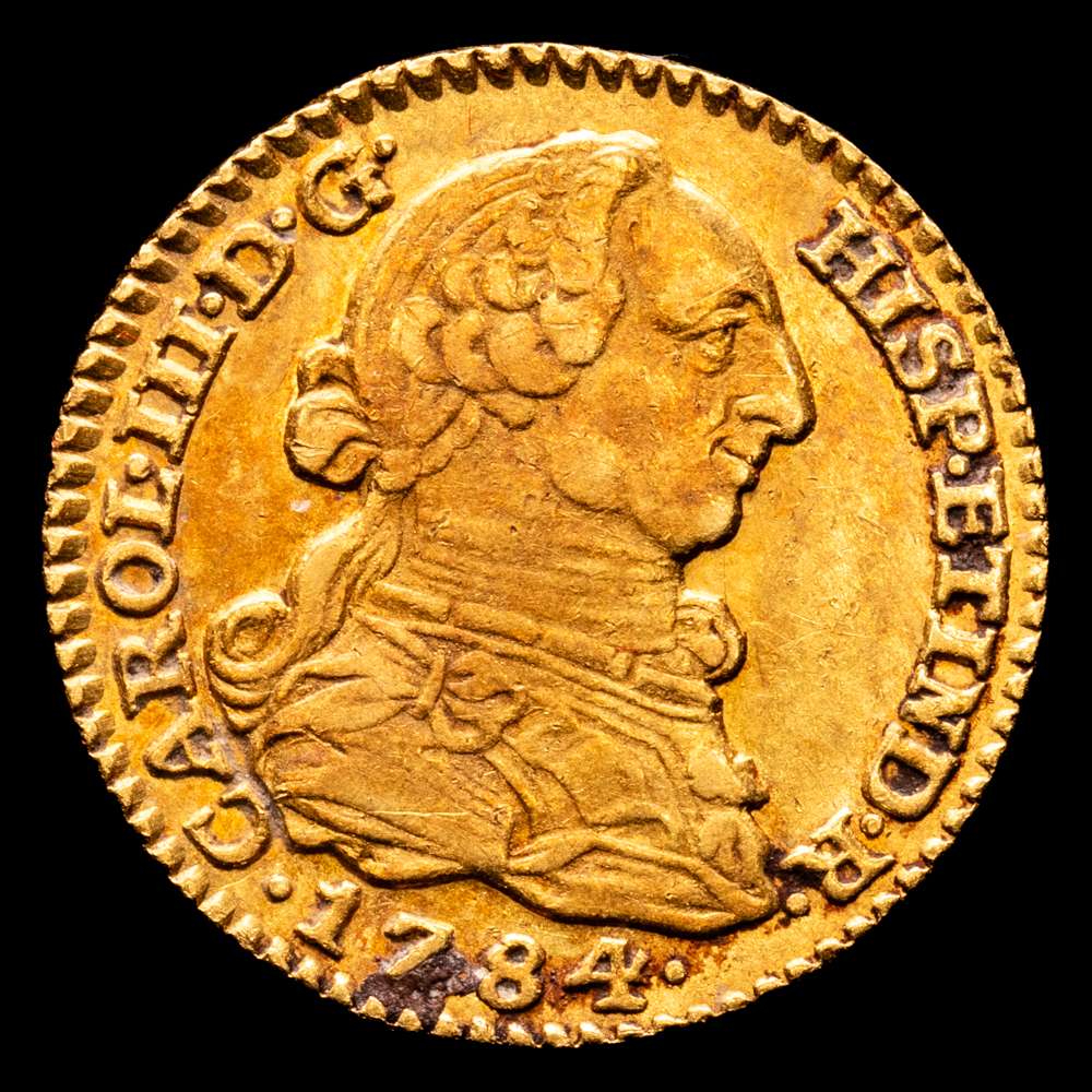 Carlos III. 1784 Madrid. J.D. 1 escudo. (AC. 1364). Parte de su brillo original. 3,36 gramos. Precioso color con una tonalidad  rojiza. EBC. Muy rara en esta conservación.