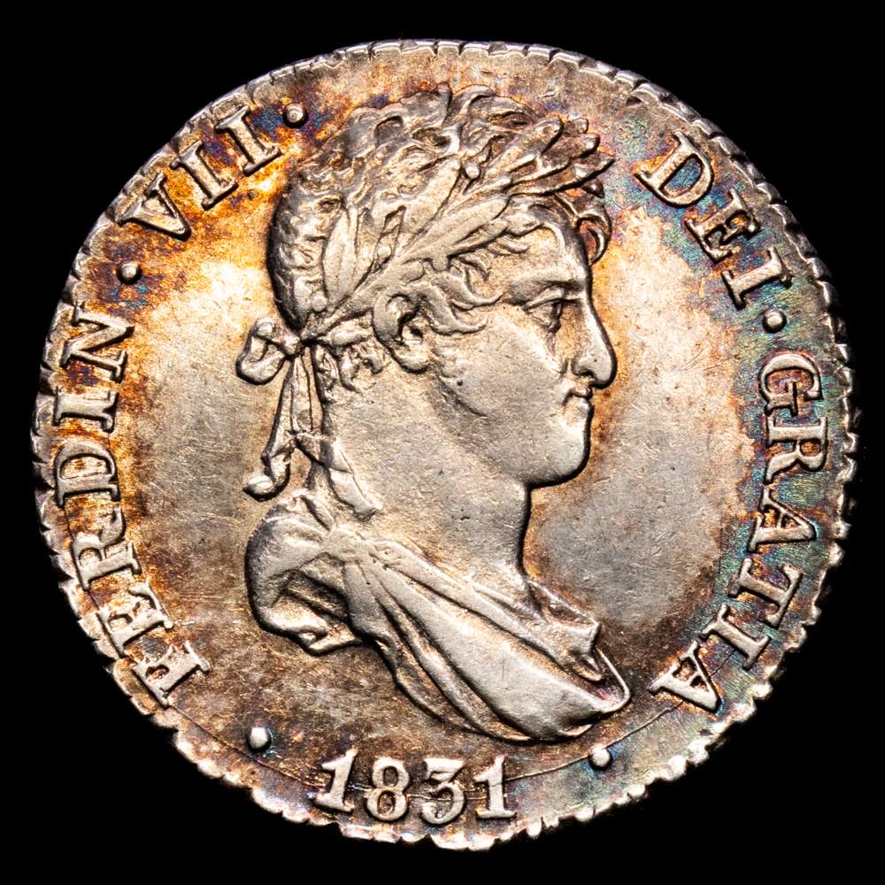 Fernando VII (1808-1833). 1 real. 1831. Sevilla. JB. (Cal-680). Ag. 3,02 g. Bello tono iridiscente en el anverso.  Restos de brillo original. EBC.