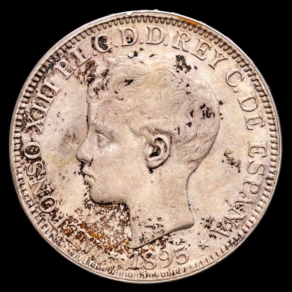 Centenario de la Peseta (1868-1931). Alfonso XIII (1886-1931). 1 peso. 1895. Puerto Rico. PGV. (Cal-128). Ag. 25,01 g. Pátina irregular. Rara. EBC-.