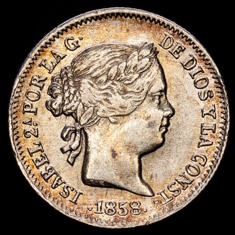 Isabel II (1833-1868). 1 real. 1858/7. Barcelona. (Cal-281). Ag. 1,26 gramos. Clara sobrefecha. Tono ligero. Escasa. MBC.