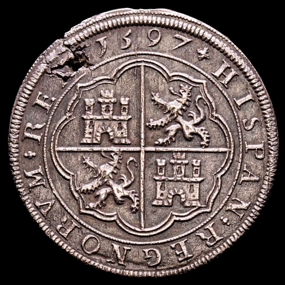 Felipe II (1556-1598). 8 Reales, 1597, Segovia. Tipo “OMNIVM”. Puntos acotando ceca y valor. acueducto, 26,33 g/12 h (Calicó 718, Dav. 8479). Defecto de flan a la 1, EBC.
