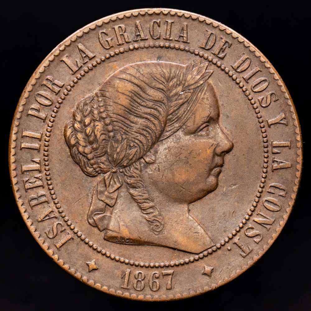 Isabel II (1833-1868). 5 céntimos de escudo. 1867. Júbia. OM. (Cal-248). Ae. 12,27 gramos. Escasa. MBC+.