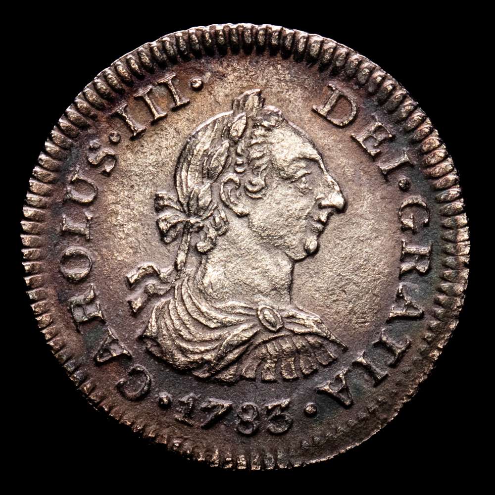Carlos III (1759-1788). 1/2 real. 1783. México. FF. (Cal-210). Ag. 1,55 g. Ligero tono iridiscente. Leves oxidaciones. XF+.