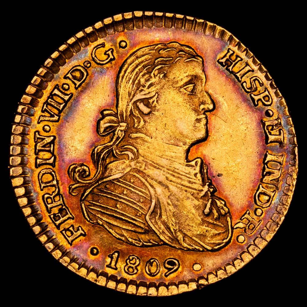 Fernando VII (1808-1833). 1 escudo. 1809. México. HJ. (Cal-1511). Au. 3,37 gramos. Busto imaginario. Muy escaso. Bello color con una bonita pátina iridiscete y restos de brillo original. EBC.