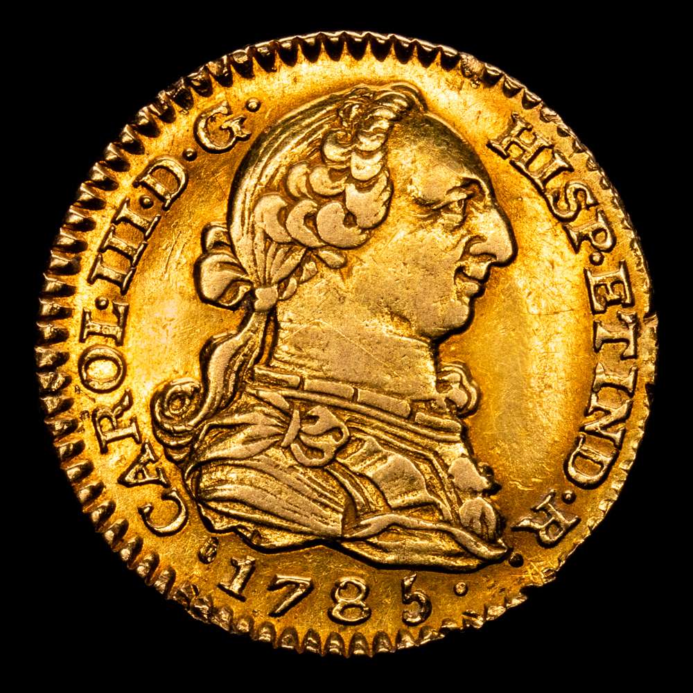 Carlos III (1759-1788). 1 escudo. 1785. Madrid. DV. (Cal-1367). Au. 3,33 gramos. Bonito color . Parte del brillo original. Escasa. EBC-/EBC.
