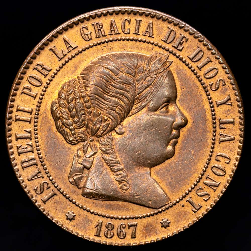 Isabel II (1833-1868). 5 céntimos de escudo. 1867. Sevilla. OM. (Cal-261). Ae. 12,68 gramos. Gran parte del brillo original. Escasa en esta conservación. EBC+.
