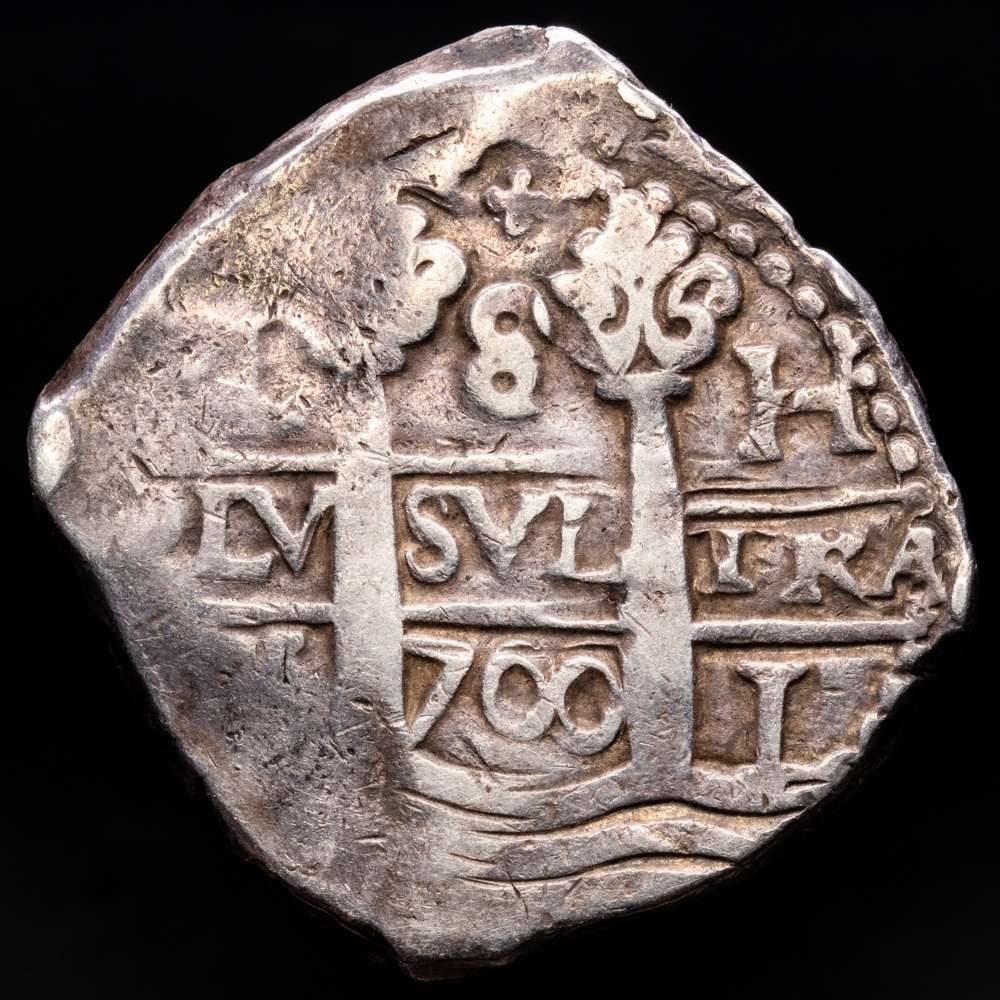 Carlos II (1665-1700). 8 reales. 1700. Lima. H. (Cal-607). Ag. 26,54 gramos. Dobe fecha, doble ceca y doble ensayador visibles. Pátina. Muy escaso. VF+.