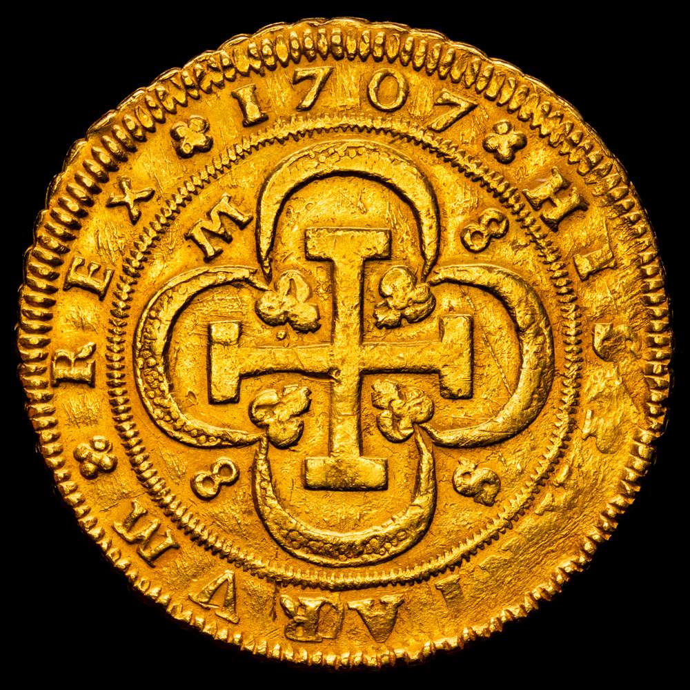 Felipe V (1700-1746). 8 escudos. 1707. Sevilla.  (AC. 2275) (Cal.Onza 488). Tipo “cruz”. M-8/8-S. Buen ejemplar. Fecha poco común. Rara. 26,76 gramos. MBC+. Bello color.